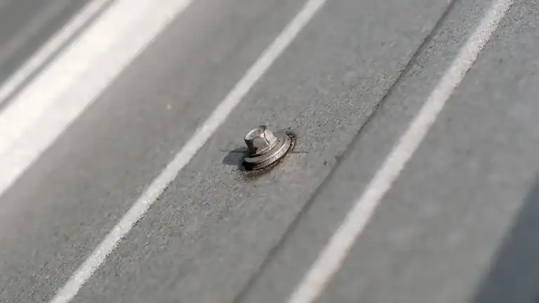 Close up of fastener on commercial metal roof