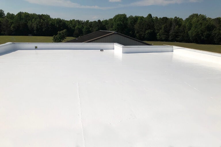 Commercial flat roof coating system, providing a seamless, durable layer that enhances waterproofing, energy efficiency, and long-term protection.