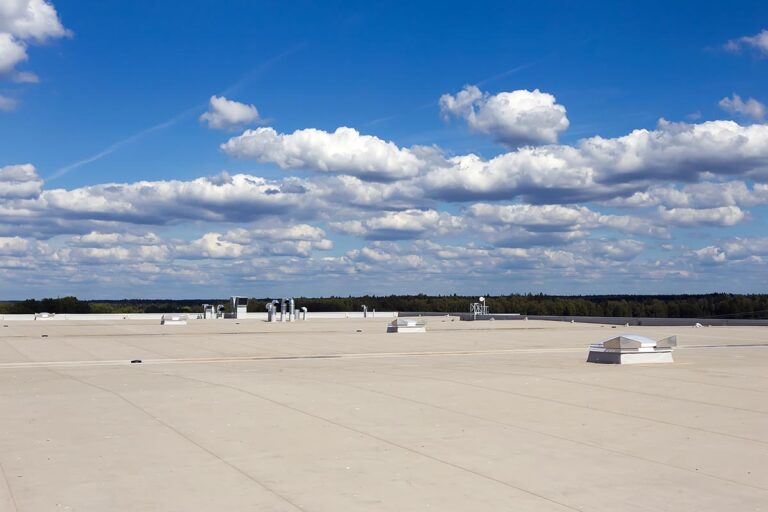 Commercial flat roofing system, featuring a durable, multi-layered membrane designed to provide superior waterproofing, energy efficiency, and long-term protection against the elements for industrial buildings.