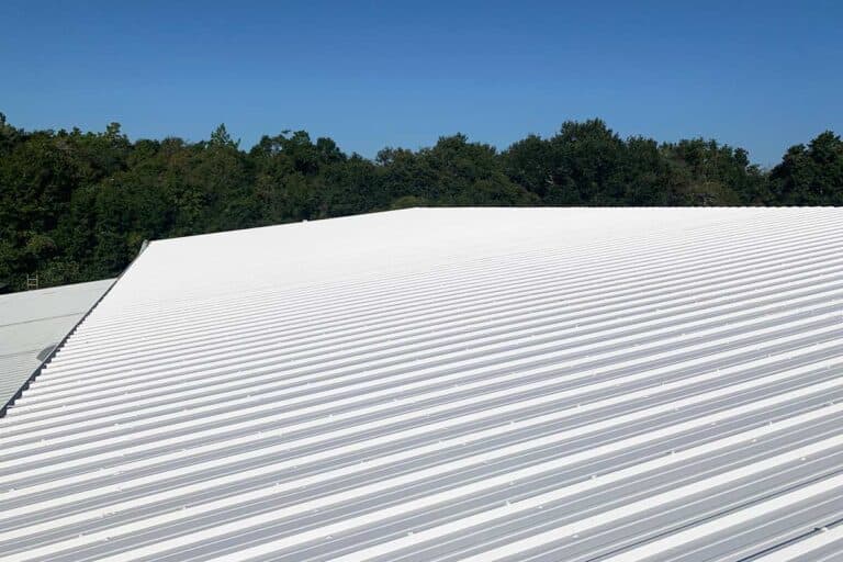 Commercial metal roof coating system, providing a durable, weather-resistant finish that enhances energy efficiency and extends the roof’s lifespan.