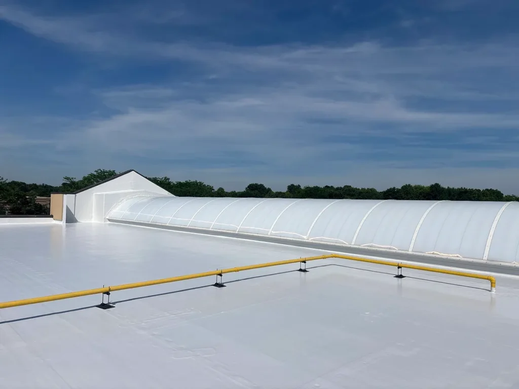 Rooftop image of high-solids silicone roof coating strip mall retail complex in New Jersey.