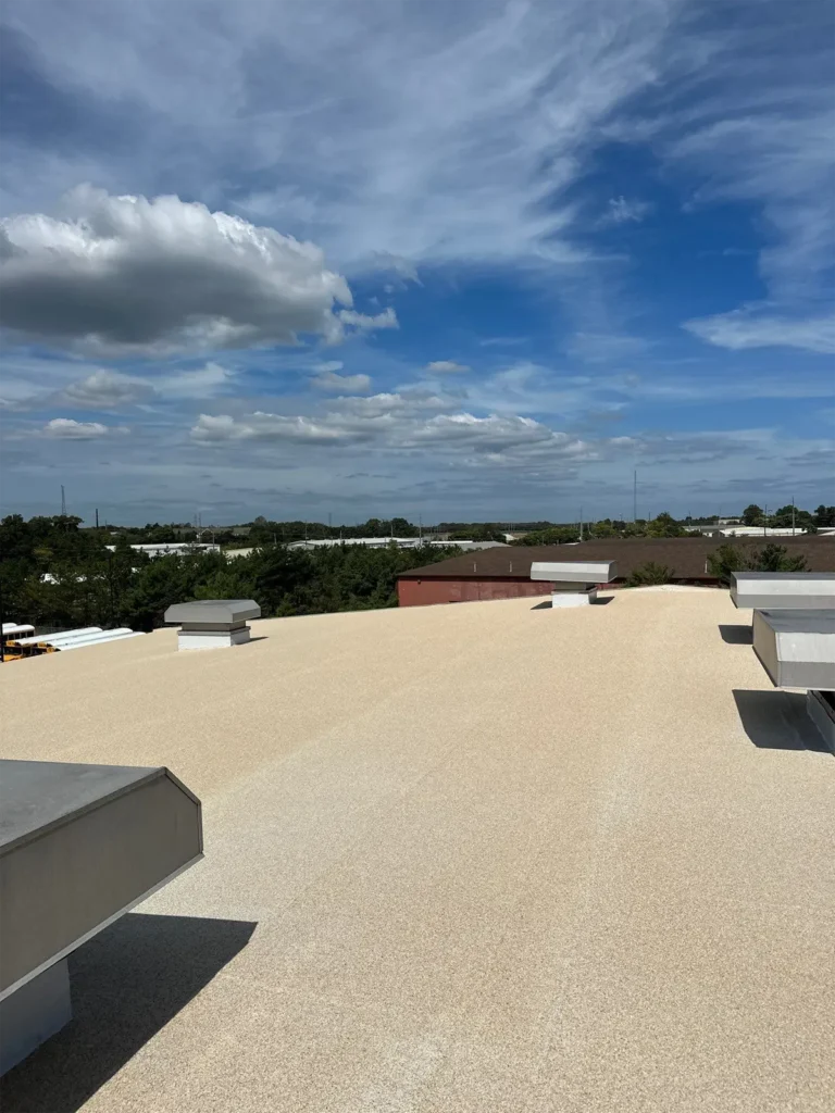 Roofing granules installed on a roof, providing a textured surface for enhanced durability, UV protection, and improved weather resistance.