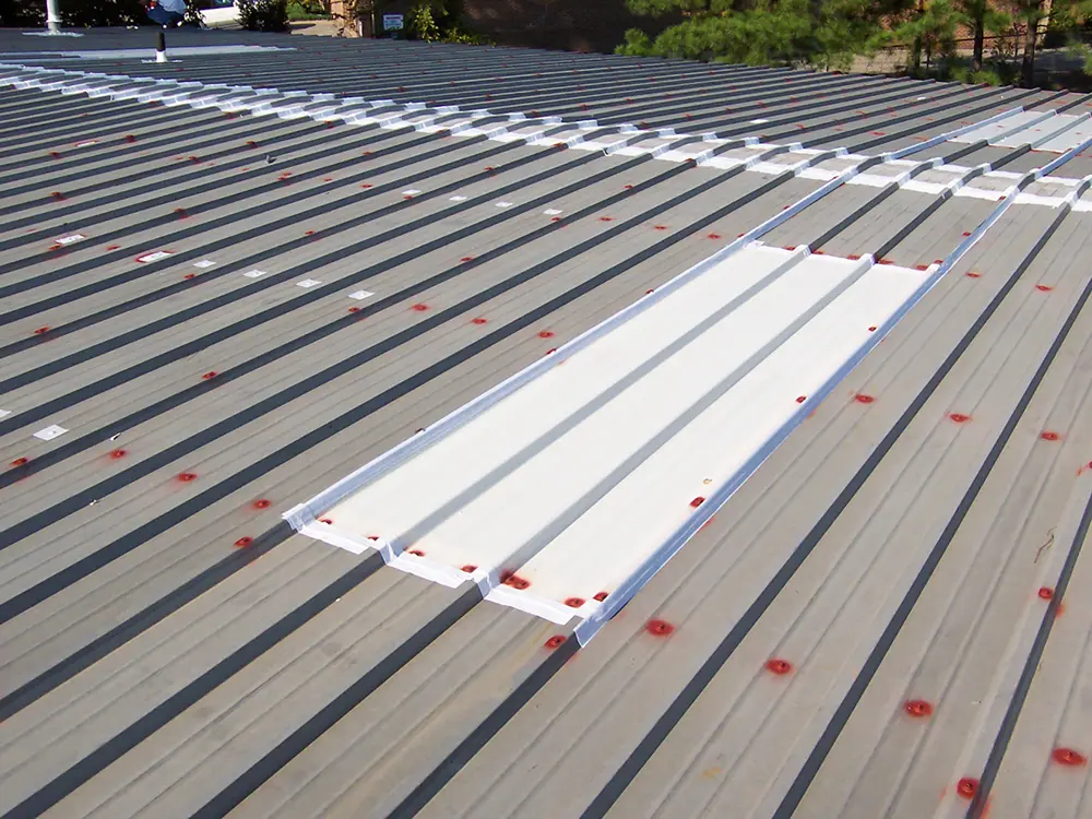 View of skylight on commercial metal roof treated with Acrylic Skylight Sealer 230.