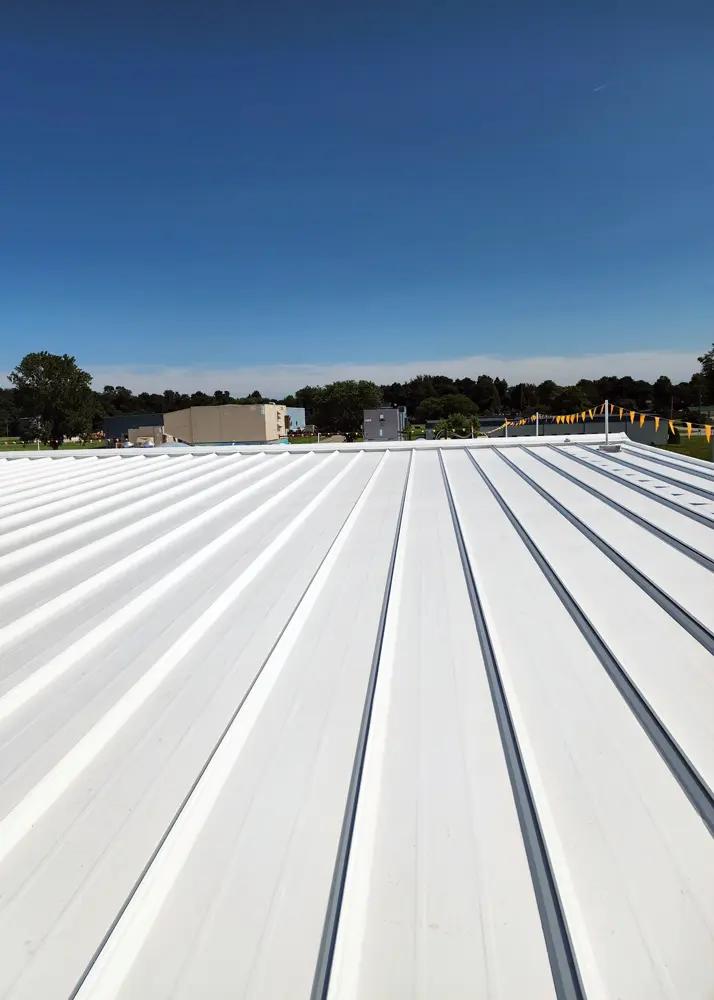 View of standing-seam metal roof with newly-applied Met-A-Gard system top coat (Acrylic 211).