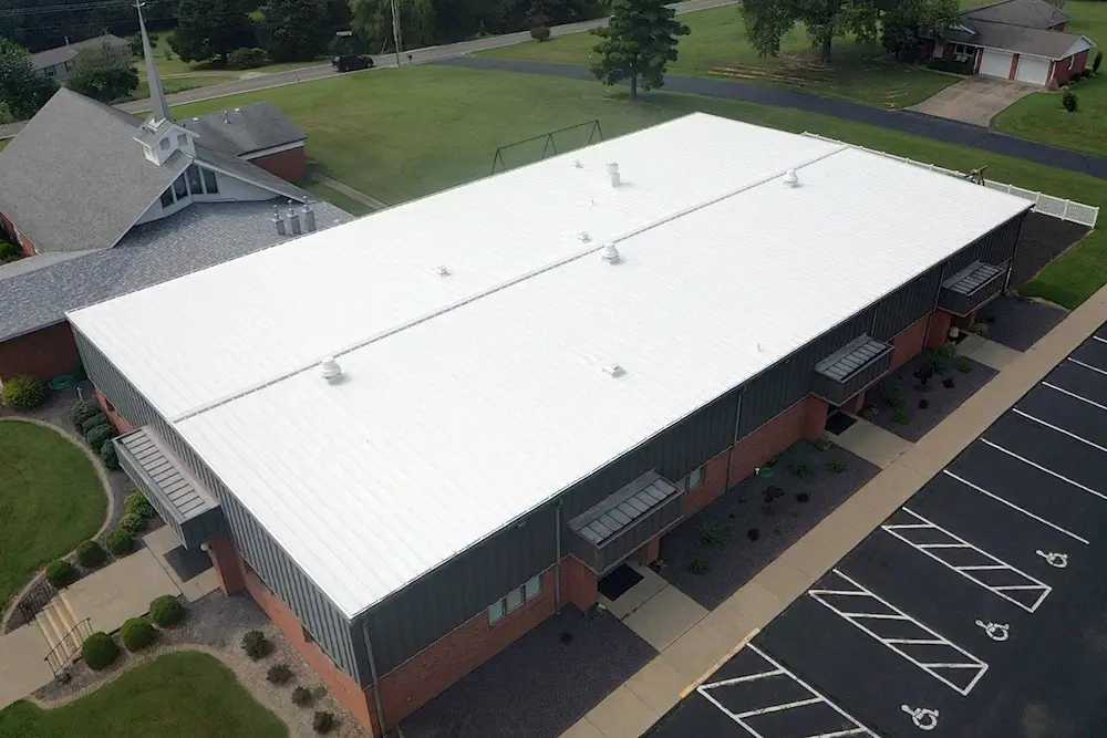 Drone image of church building with newly-installed Met-A-Gard+ metal roof restoration system.