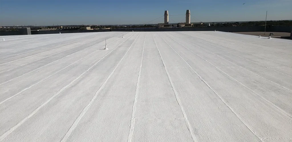 On-the-roof image of high-solids silicone top coat of Ure-A-Sil California roof restoration system.