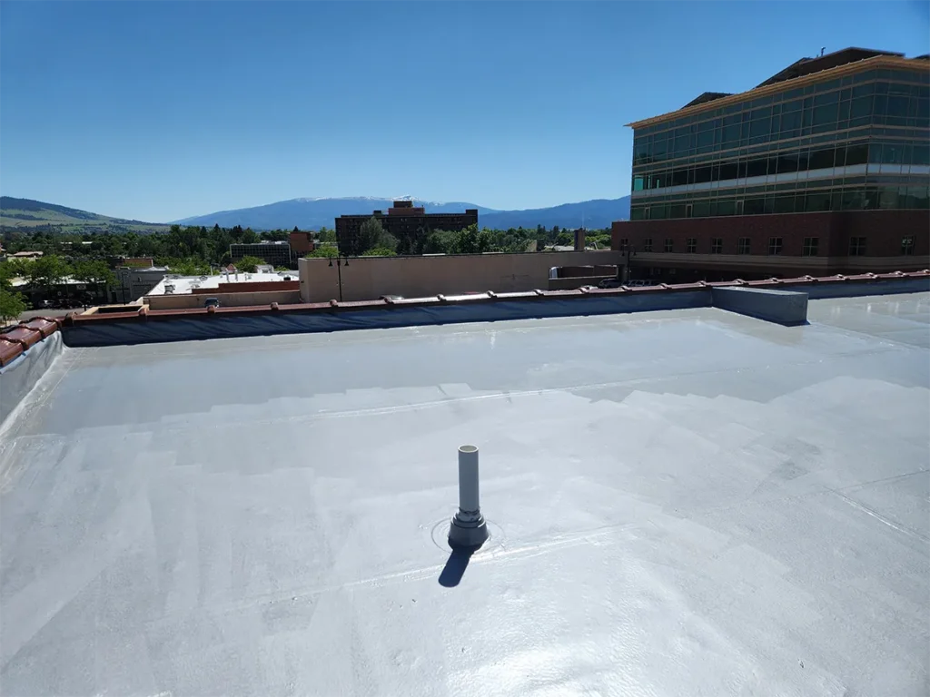 Image of low-VOC urethane base coat on commercial flat roof.
