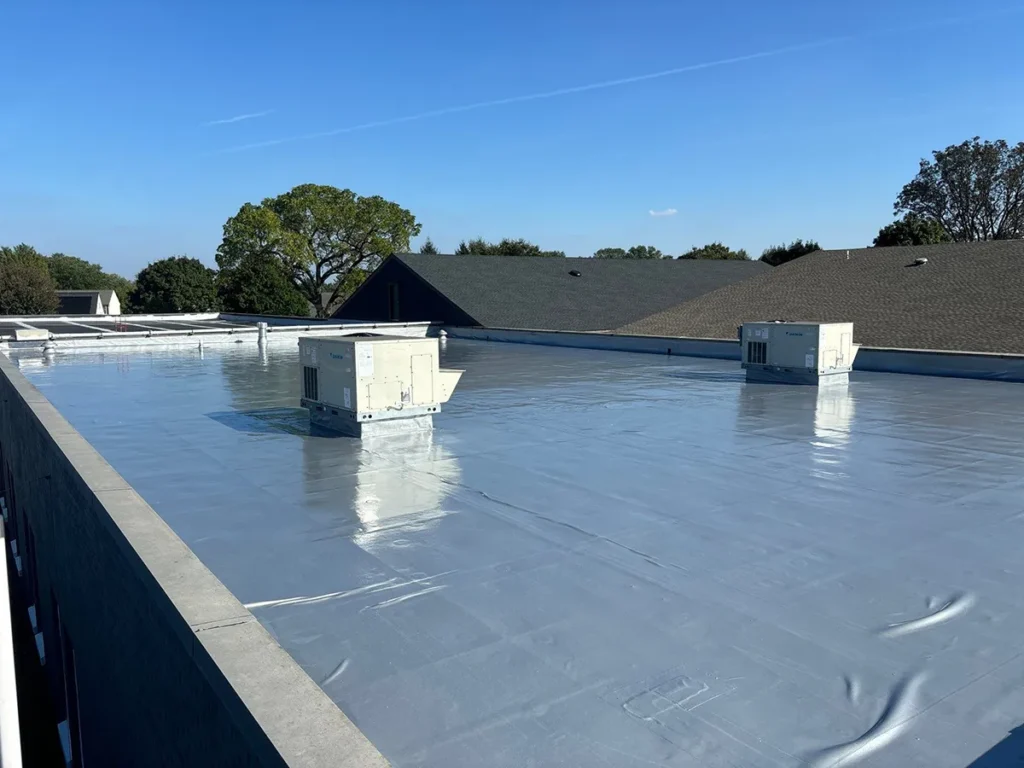 Commercial flat roof showing the urethane base coat of the Ure-A-Sil roof coating system.