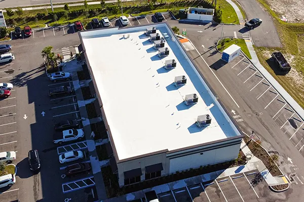 Drone view of completed Ure-A-Sil system on single-ply roof, providing superior waterproofing and UV protection.