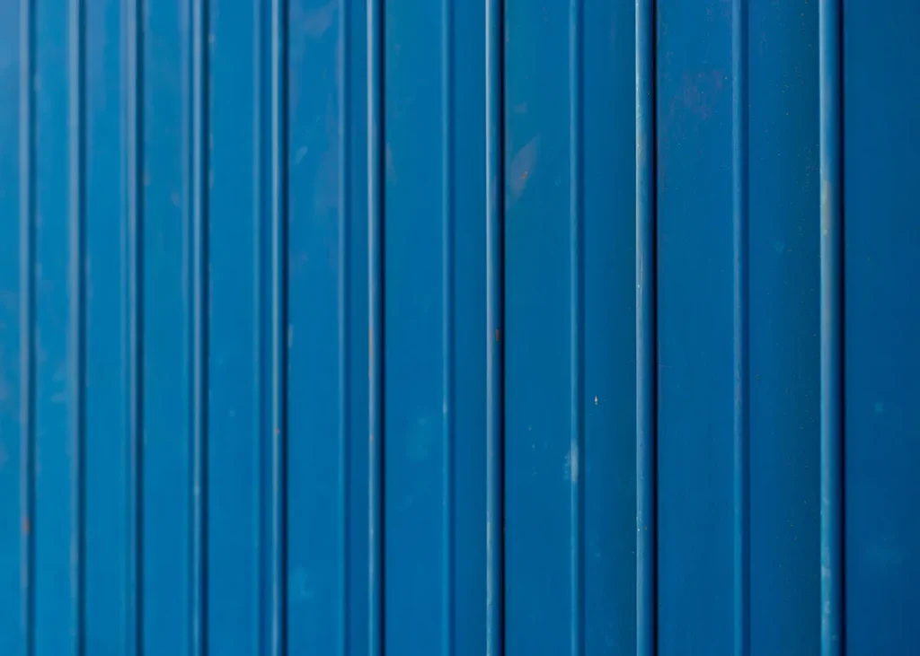 Blue-tinted metal siding of Wall-Coat system