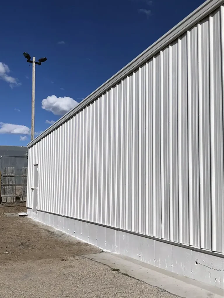 White coated metal siding on commercial building