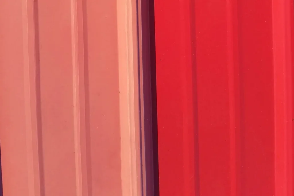 Close-up of metal siding before and after application of direct-to-metal coating