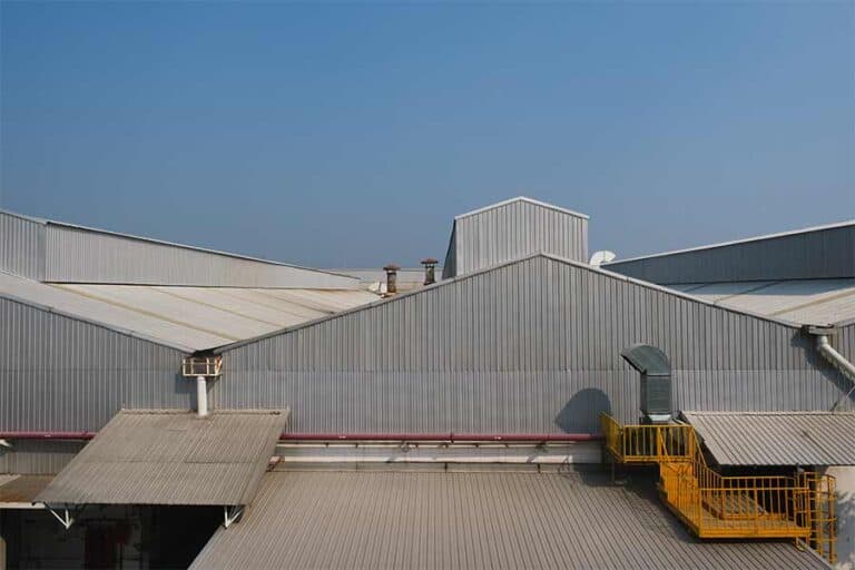 "Industrial building with a metal roof, providing a durable and weather-resistant surface designed for long-term protection and energy efficiency.