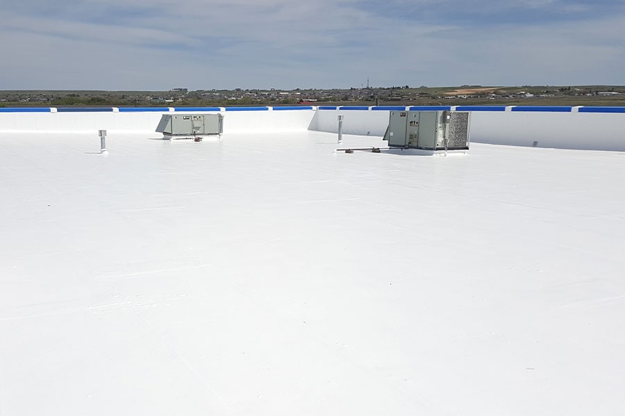 Finished elastomeric silicone roof, showcasing its high-performance, flexible coating that adapts to roof movement while maintaining excellent protection and extending roof lifespan.