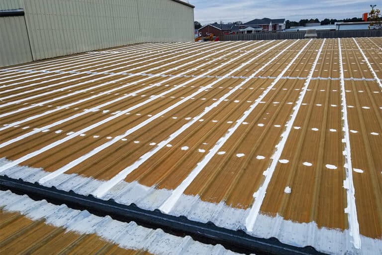 Completed roof with mastics and sealants applied to seams and fasteners, ensuring a secure, waterproof seal for long-term protection and durability.