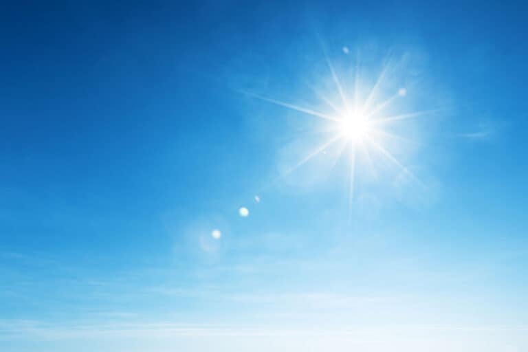 Picture of the sun beaming down, highlighting its powerful rays and the impact of solar energy on roofing and energy efficiency.