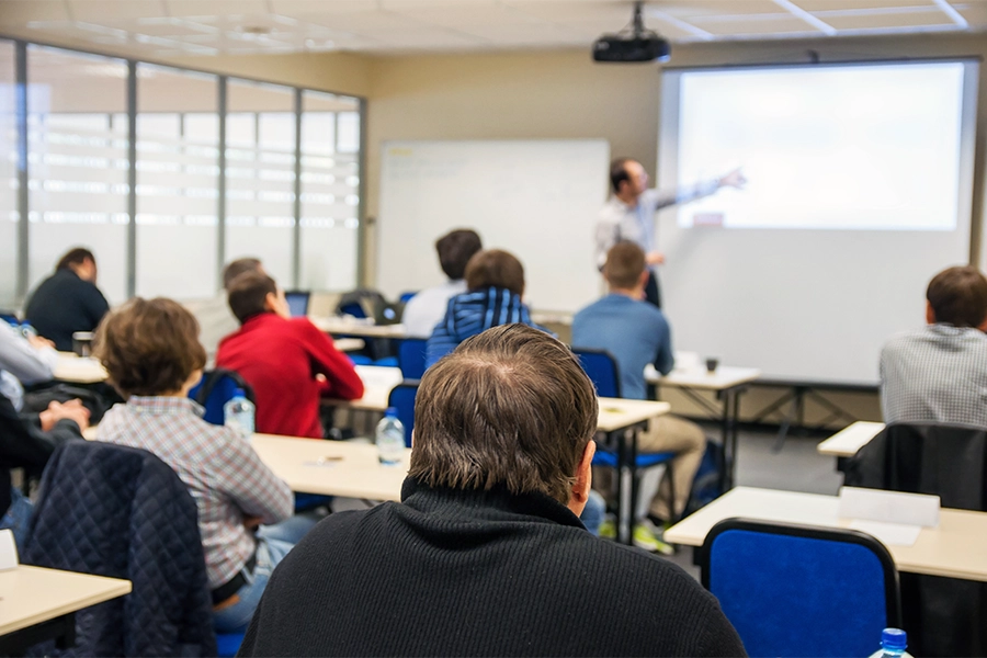Group of commercial roofing contractors viewing presentation.