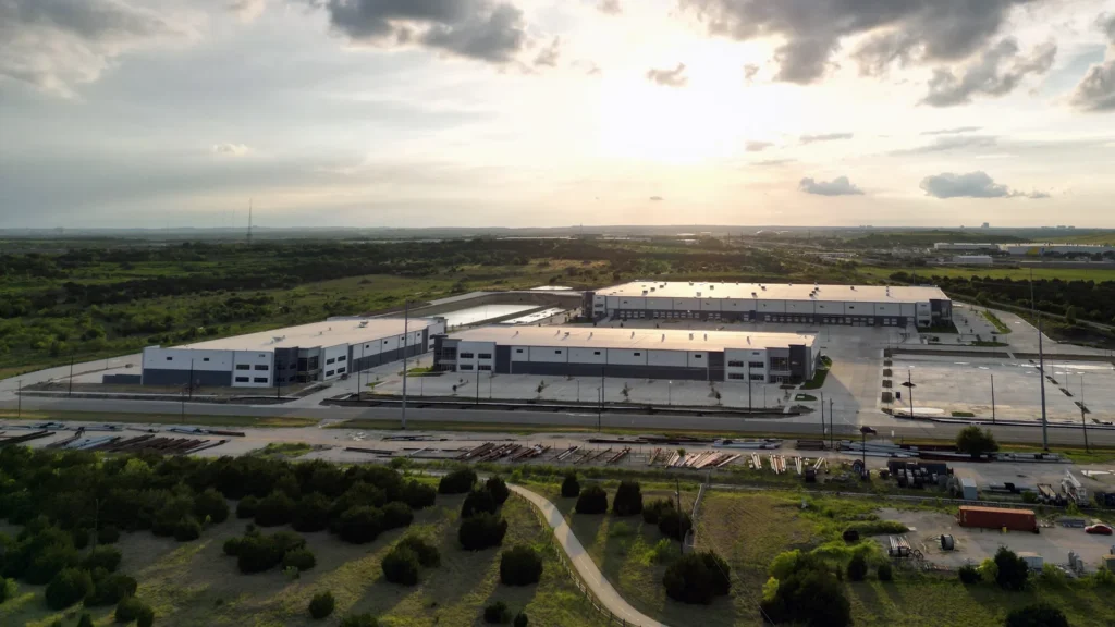 Aerial image of industrial park buildings with roof restoration systems.