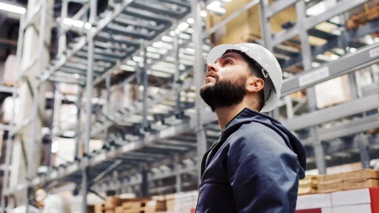 Facility manager in large industrial warehouse
