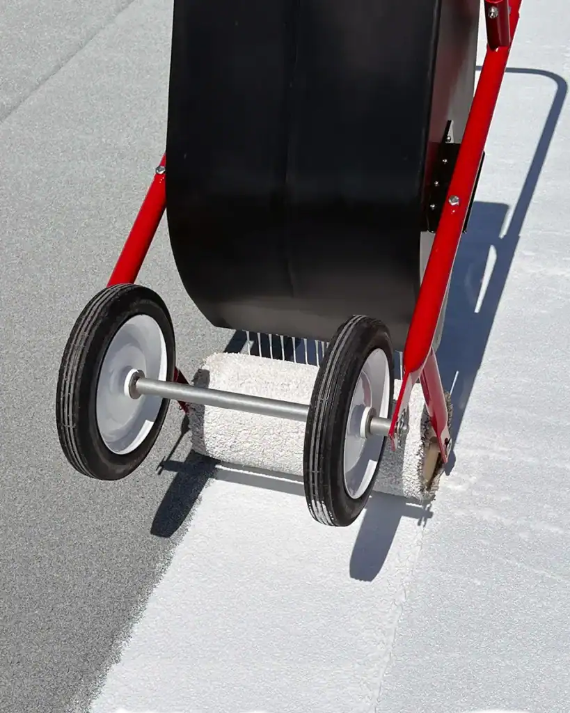 Tank spreader applying roof coating