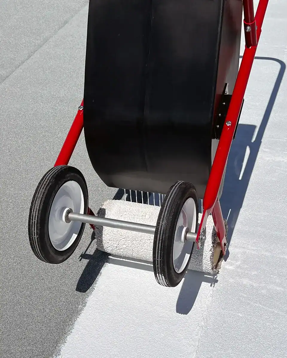 Tank spreader applying roof coating