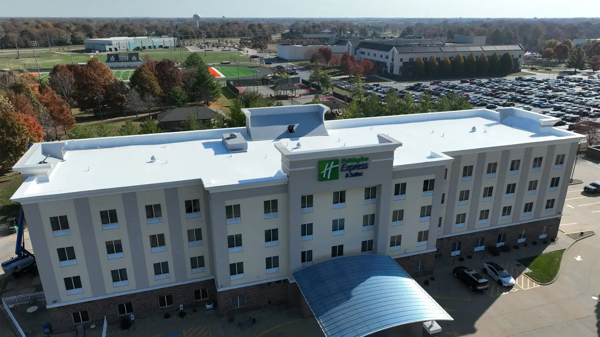 Aerial view of hotel building with flat roof coating system