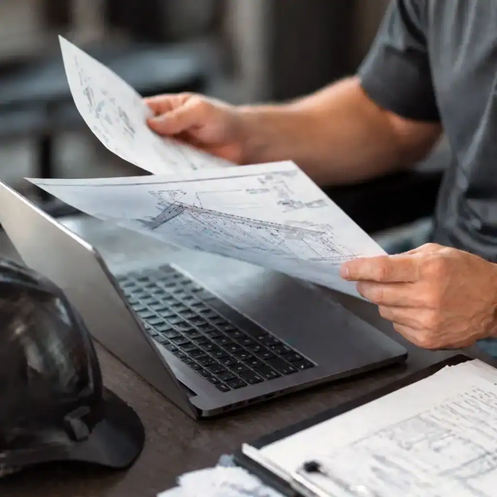 Roofing contractor reviewing technical documents