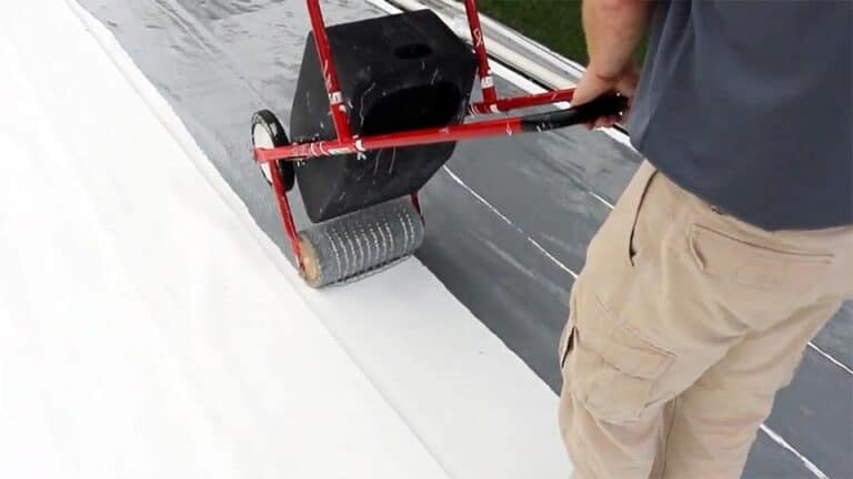 Eric Long demonstrating how to use a tank spreader
